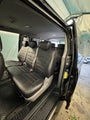 AutoLeathers custom-fit leather seat covers on an 8-seater middle bench, side door open