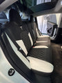 AutoLeathers custom-fit leather seat covers on a 5-seater rear bench, rear door open